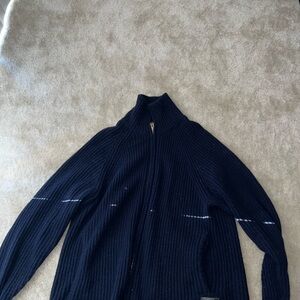 Blue Zip Up Sweater with High Collar and Textured Fabric